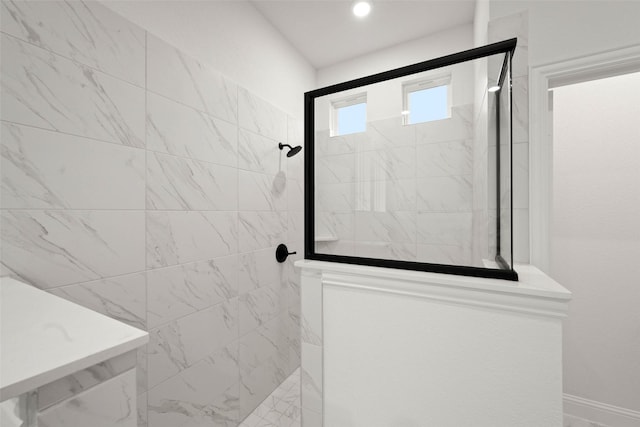 bathroom with tiled shower