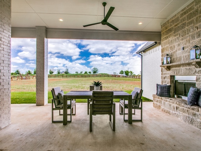 view of patio featuring a rural view and ceiling fan