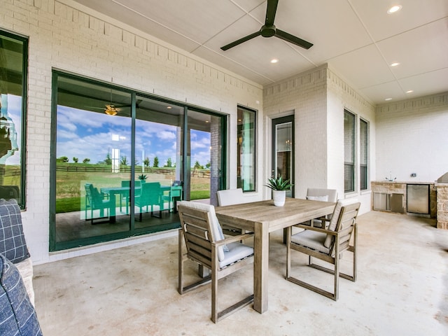 view of patio / terrace with ceiling fan and area for grilling