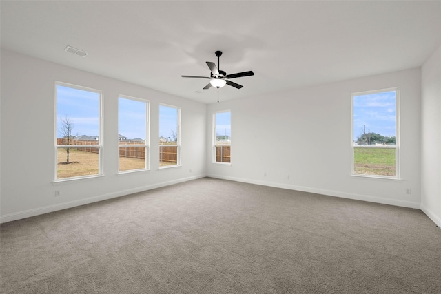 empty room with carpet flooring and ceiling fan