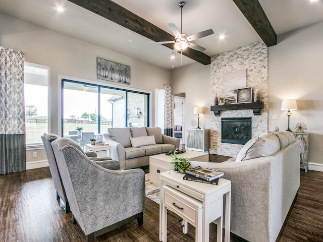 living room with ceiling fan, a fireplace, beam ceiling, and dark hardwood / wood-style floors