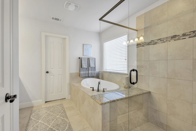 bathroom featuring shower with separate bathtub and tile patterned flooring