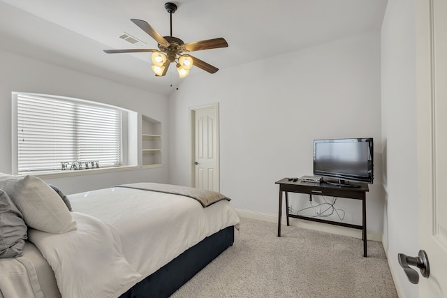 bedroom with vaulted ceiling, ceiling fan, and light colored carpet