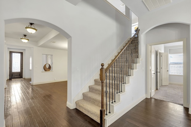 foyer with dark hardwood / wood-style flooring