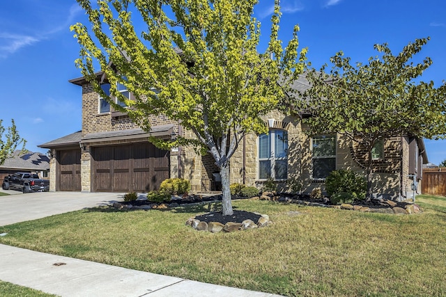 view of property hidden behind natural elements with a front yard and a garage