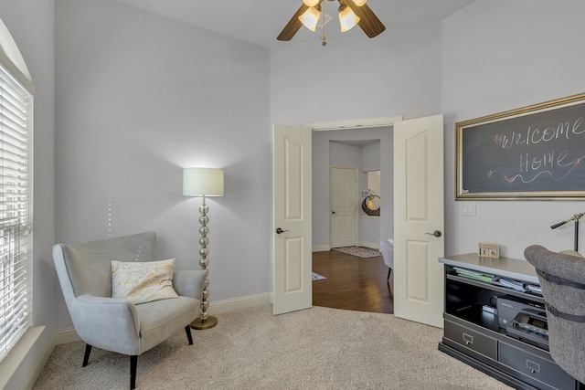 sitting room featuring ceiling fan and hardwood / wood-style floors