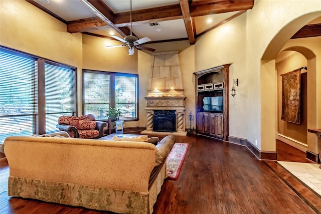 living room with a fireplace, coffered ceiling, beam ceiling, and dark hardwood / wood-style flooring