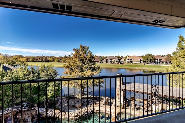 balcony featuring a water view