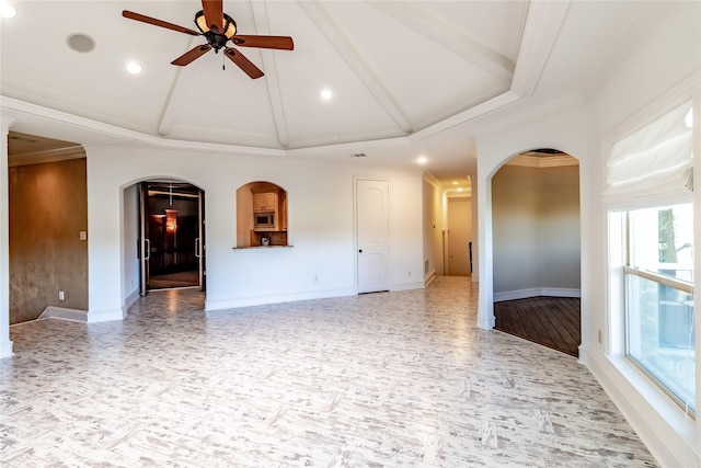 unfurnished room featuring vaulted ceiling, ceiling fan, and ornamental molding