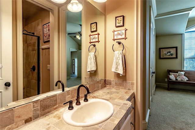 bathroom with a shower with door and vanity