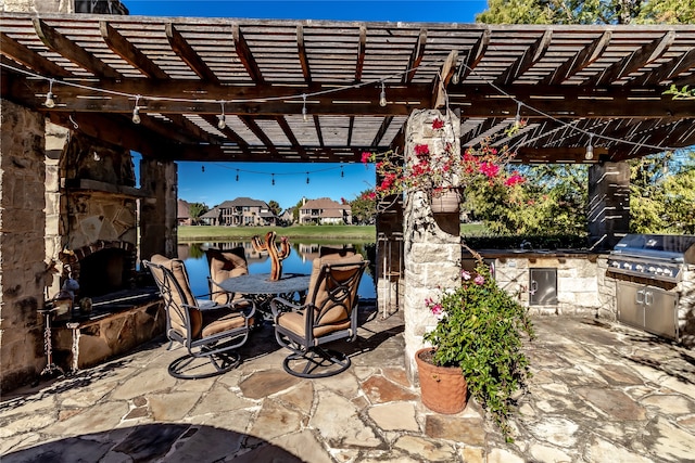 exterior space with an in ground hot tub and a water view