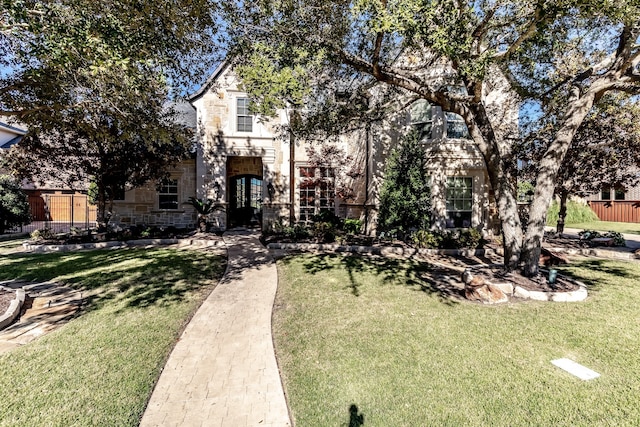 view of patio / terrace featuring an outdoor kitchen, a pergola, an outdoor stone fireplace, and a grill