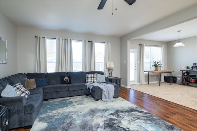 living room featuring hardwood / wood-style flooring and ceiling fan