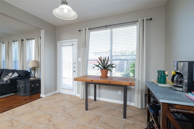 interior space featuring plenty of natural light and light tile patterned floors