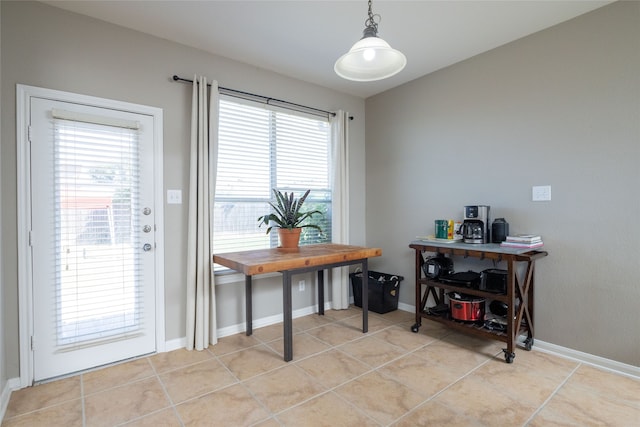 tiled dining area with a wealth of natural light