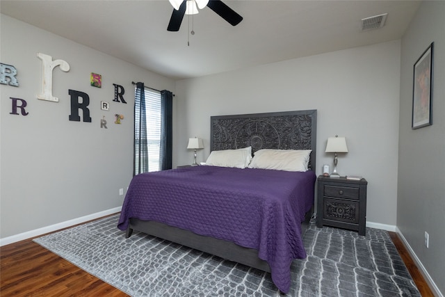 bedroom featuring ceiling fan and dark hardwood / wood-style flooring