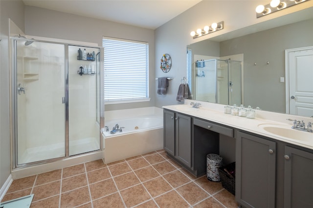 bathroom with tile patterned flooring, vanity, and shower with separate bathtub