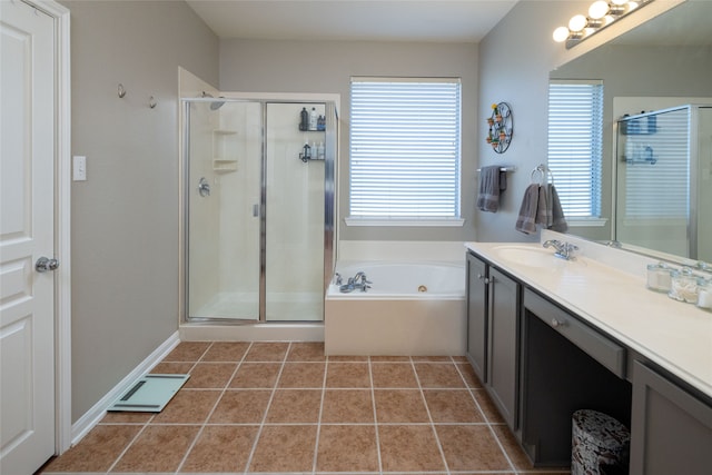 bathroom with vanity, tile patterned floors, and independent shower and bath