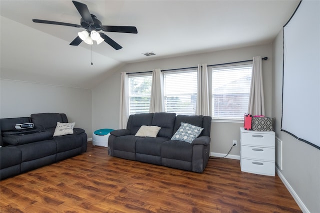 living room featuring vaulted ceiling, ceiling fan, and dark wood-type flooring