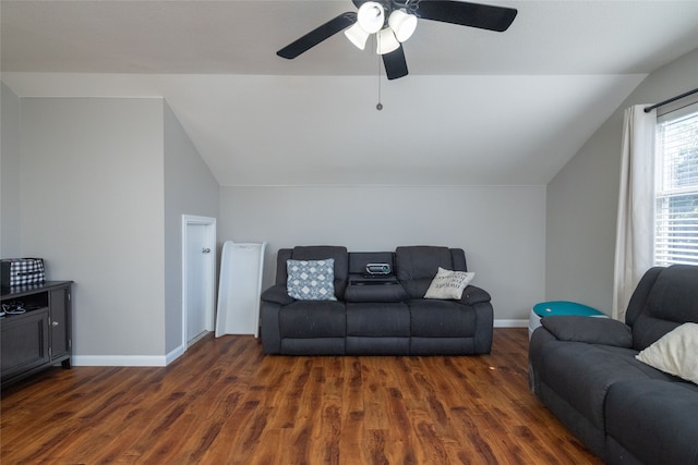 living room featuring ceiling fan, lofted ceiling, and dark wood-type flooring