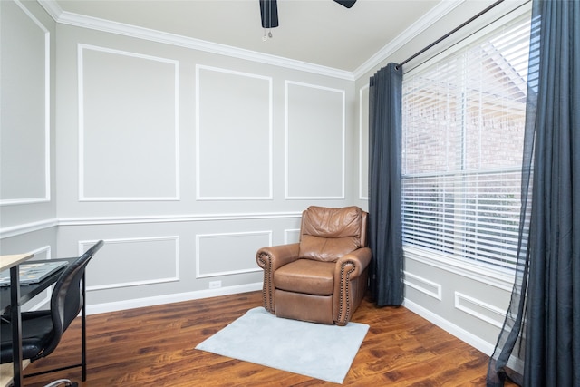 sitting room with ornamental molding, ceiling fan, and dark wood-type flooring