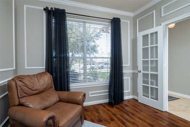 living area featuring crown molding and dark wood-type flooring