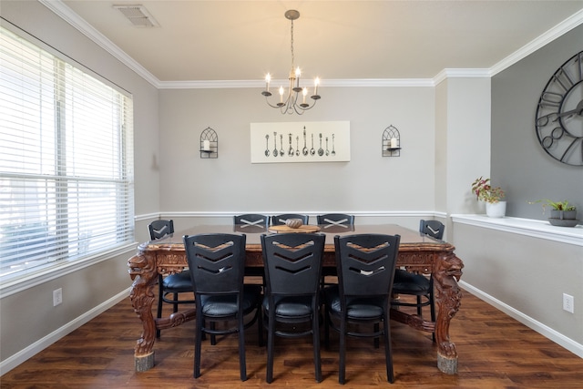 dining space with crown molding, dark wood-type flooring, and a notable chandelier