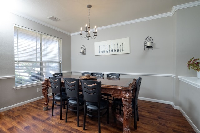 dining space featuring a notable chandelier, ornamental molding, and dark wood-type flooring