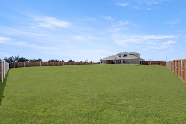 view of yard featuring a fenced backyard