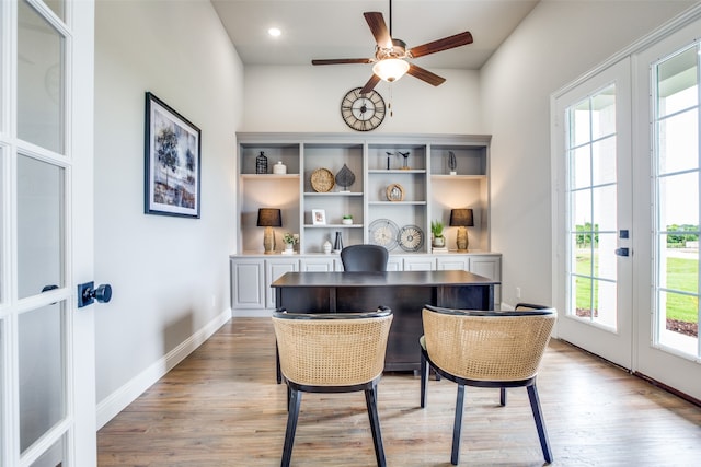 office area featuring french doors, light hardwood / wood-style floors, and a wealth of natural light