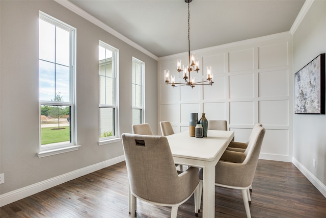 dining area featuring dark hardwood / wood-style floors, a chandelier, and ornamental molding