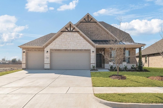 craftsman house with a garage and a front lawn