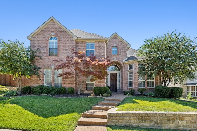 view of front of house with a front lawn