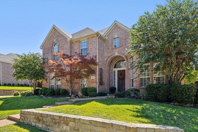 view of front of home with a front lawn