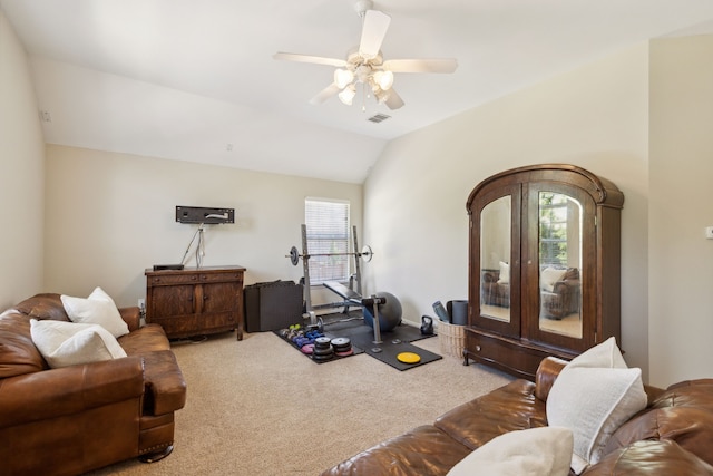 living room featuring ceiling fan, carpet flooring, and vaulted ceiling