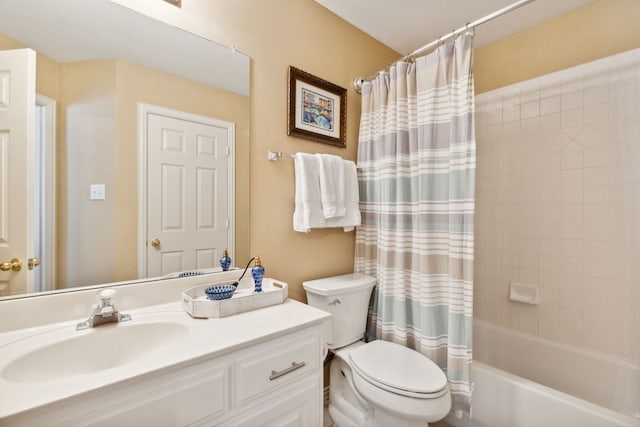 full bathroom with vanity, toilet, and shower / tub combo with curtain