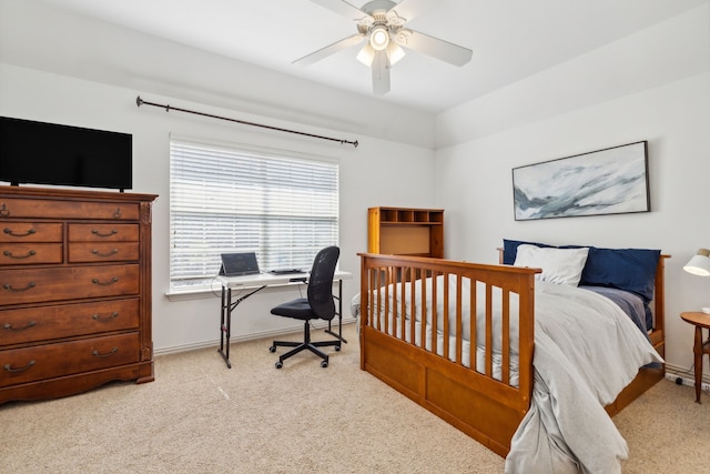 bedroom featuring light colored carpet and ceiling fan