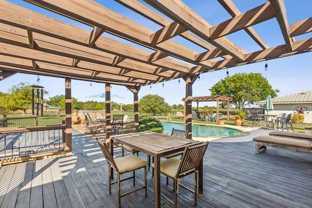 wooden deck featuring a pergola and a water view