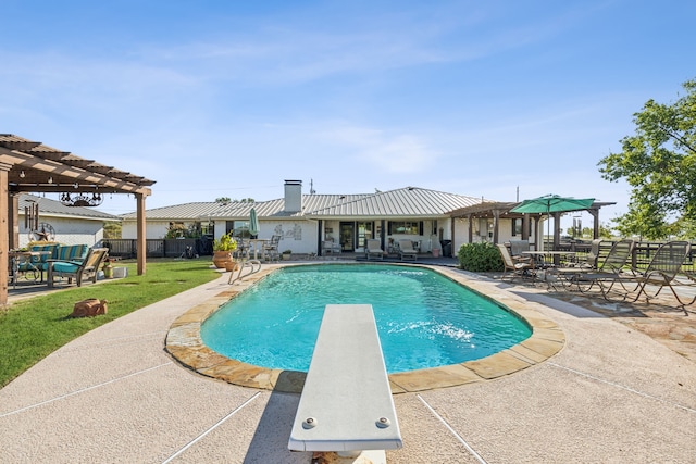 view of swimming pool featuring a diving board, a pergola, a patio area, and a lawn