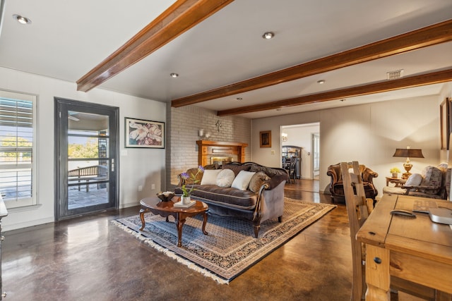 living room with beamed ceiling and a fireplace