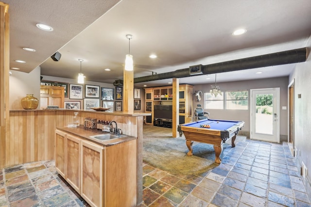 game room with wet bar, wood walls, and pool table