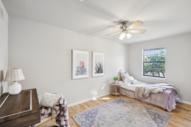 bedroom featuring ceiling fan and light hardwood / wood-style flooring