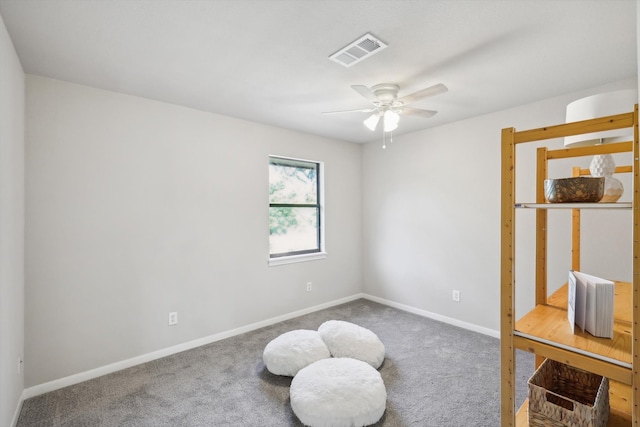 interior space with ceiling fan and carpet flooring