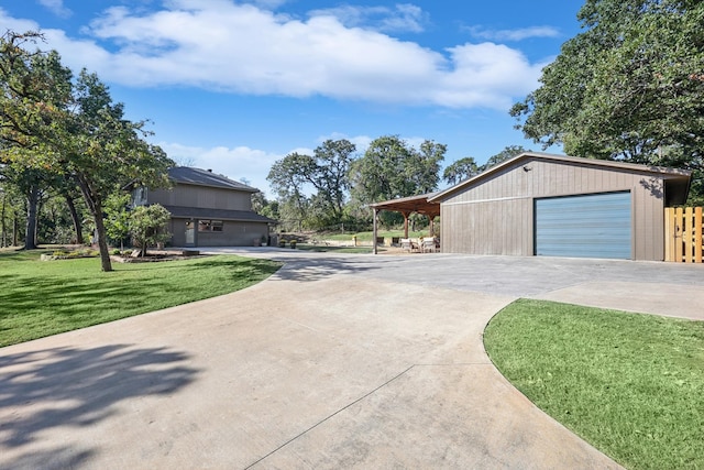 view of property exterior with an outdoor structure, a garage, and a yard