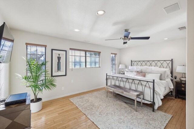 bedroom featuring light wood-type flooring and ceiling fan