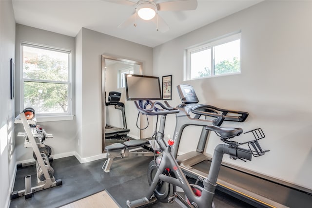 exercise room with ceiling fan and plenty of natural light