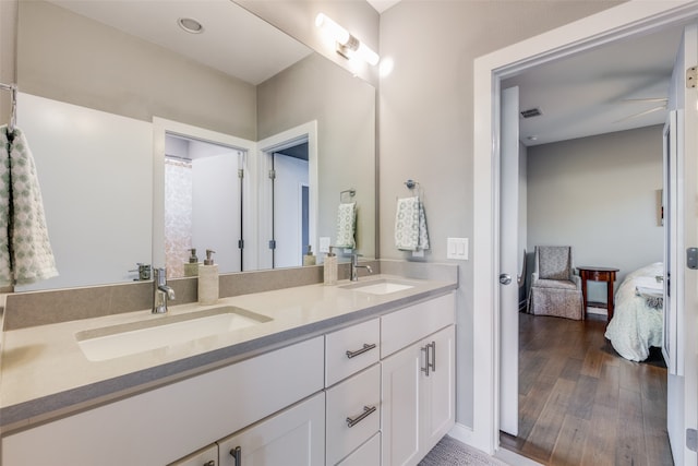 bathroom featuring vanity and hardwood / wood-style floors