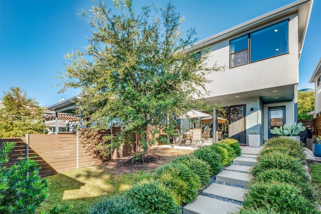 back of house featuring a patio area