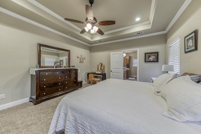 bedroom with ceiling fan, a tray ceiling, ornamental molding, and carpet