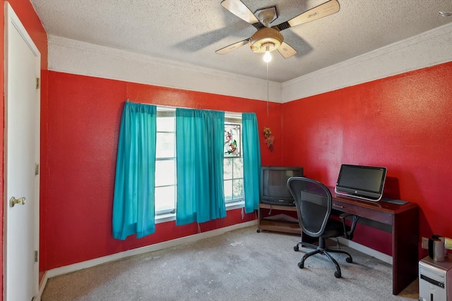 carpeted home office with ceiling fan, a textured ceiling, and ornamental molding